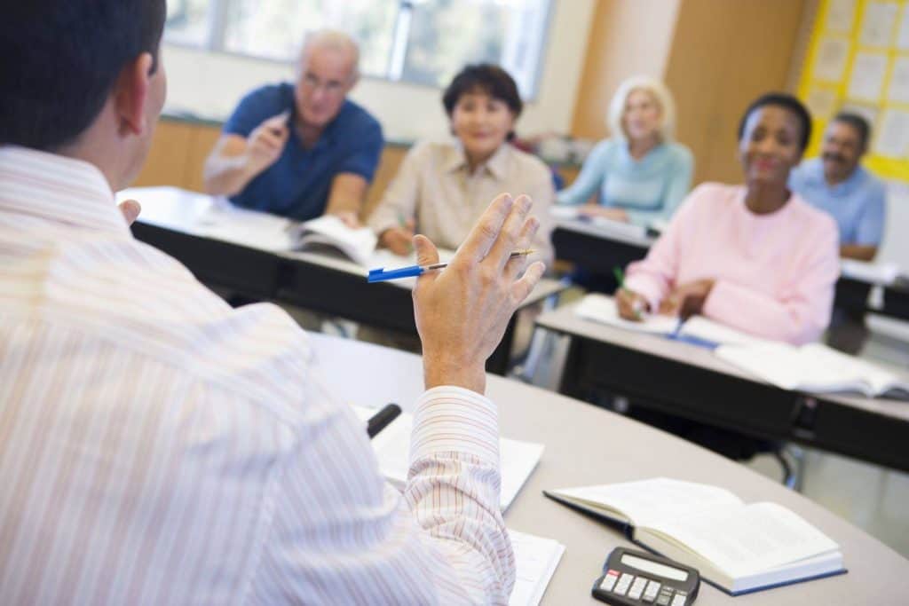 teacher teaching adult students