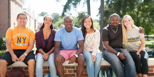 NC Wesleyan students on wall