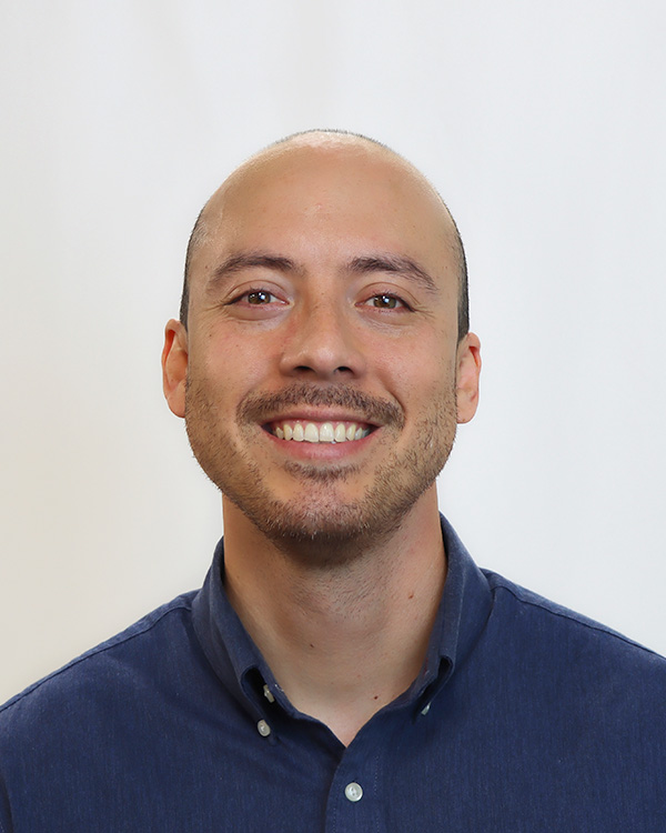 male professor in navy shirt