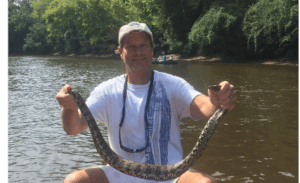 man holding snake