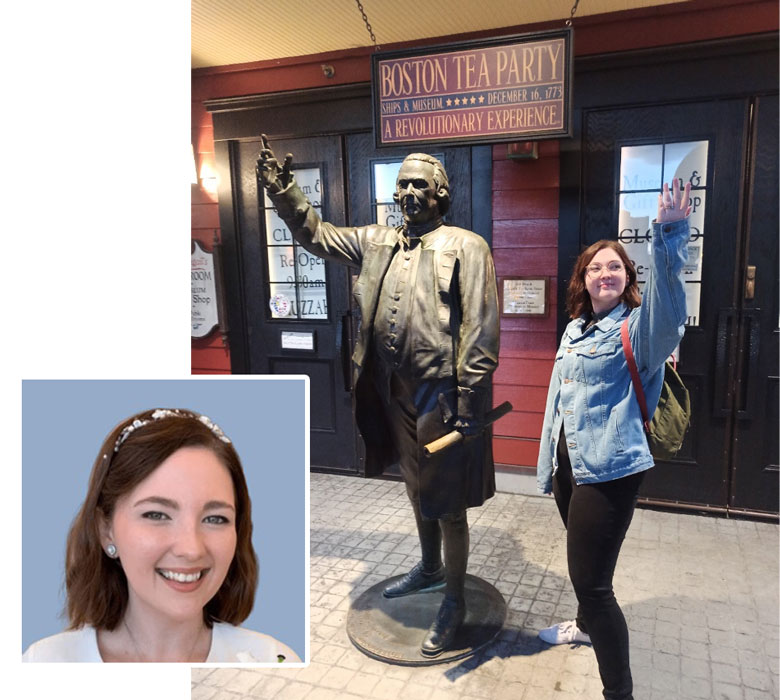 white female student standing next to boston tea party statue