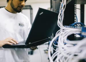 computer technician working on network