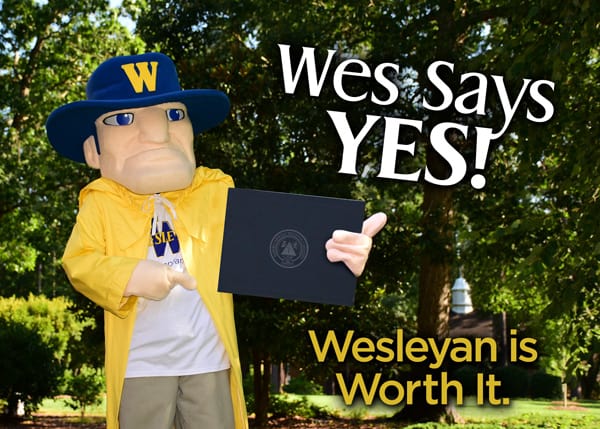 wes the mascot holding diploma