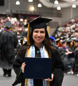 graduate student holding diploma