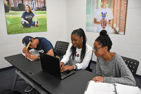 students around classroom tables