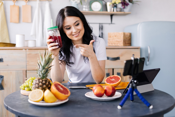 athletic smiling young woman eating healthy