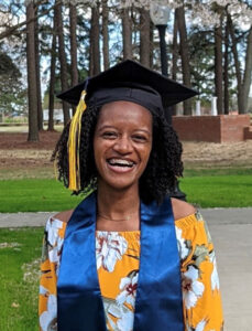 black female graduate smiling