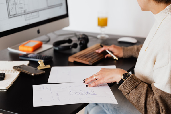 woman looking over bills and retirement paperwork