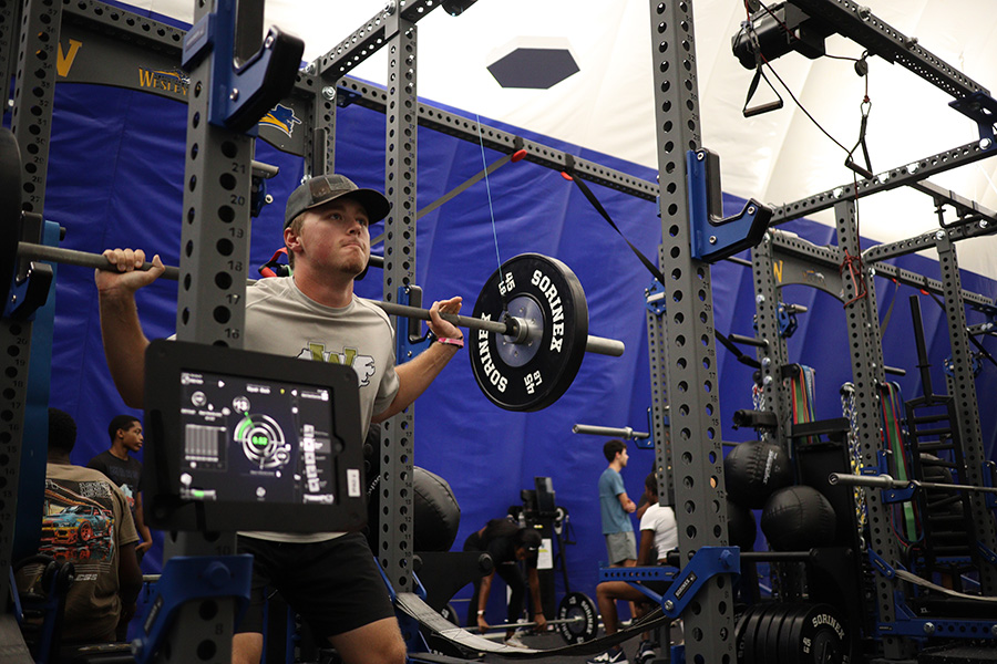 ISEF Tech Zach_2830 student lifting wieghts with strength & conditioning technology