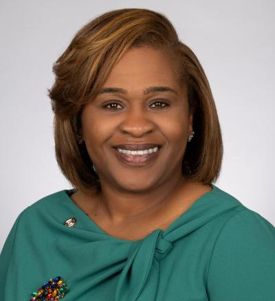 female black professional in green dress