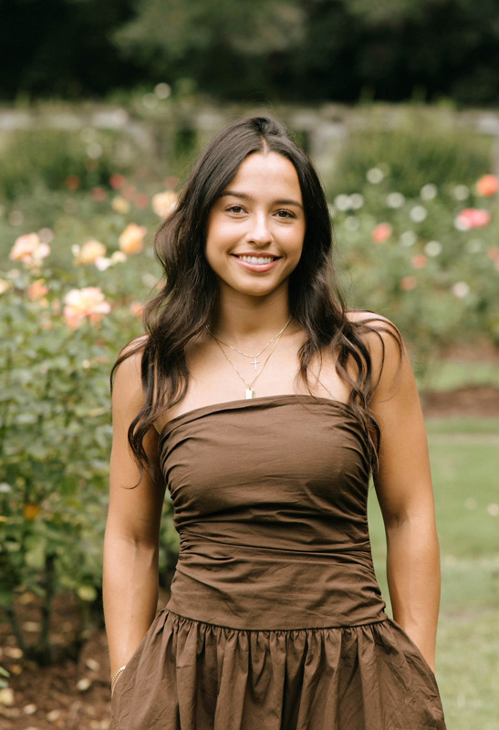 female standing in garden