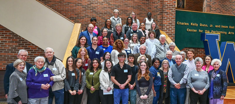 group of students standing on stairs