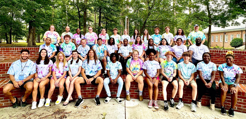 group of students sitting in outdoor classroom