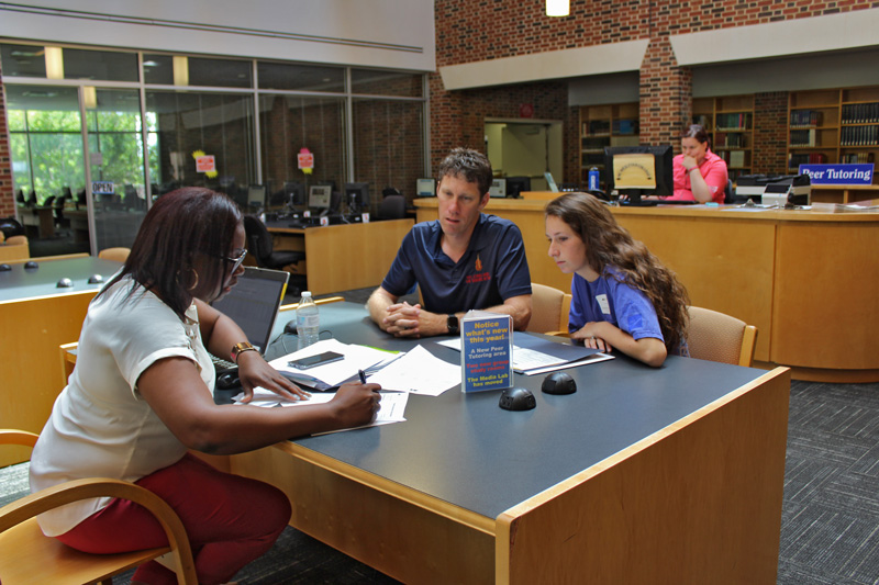 advisor with student and parent in ncwu library