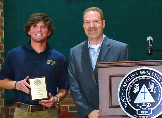 student recieving awards from professor